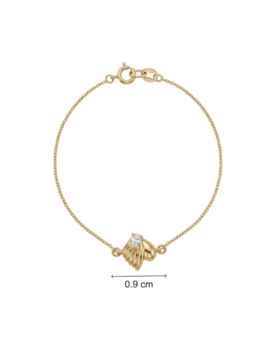 A delicate gold chain bracelet with a small gold heart-shaped charm set with a clear gemstone, shown on a white background with a '0.9 cm' width measurement indicator below.