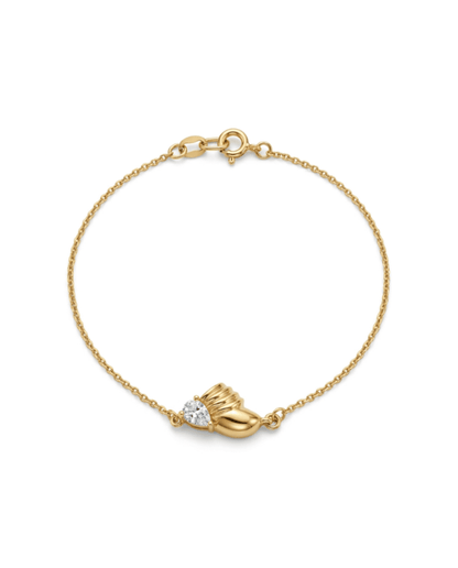 A delicate gold chain bracelet with a small gold heart-shaped charm and a clear heart-shaped gemstone, displayed on a clean white background.