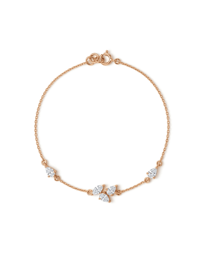 A delicate rose gold chain bracelet with a small cluster of clear marquise-cut and round gemstones at the center, displayed on a clean white background.